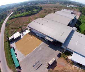 A drone captures an image of the rice processing facility